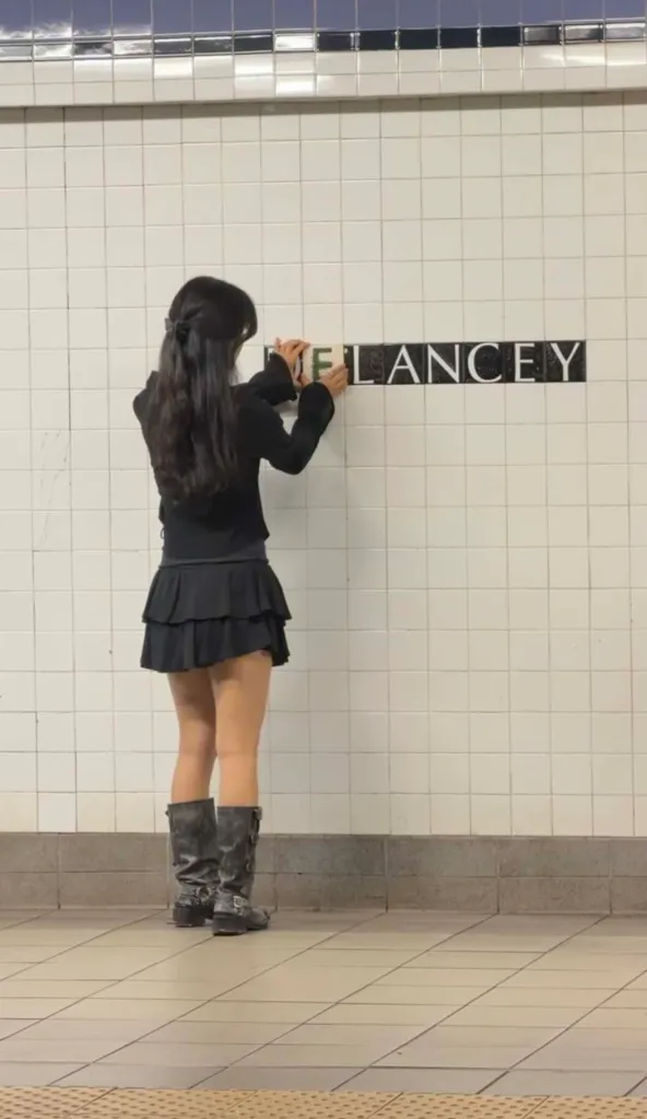 An artist replaces missing subway tiles with art at the 