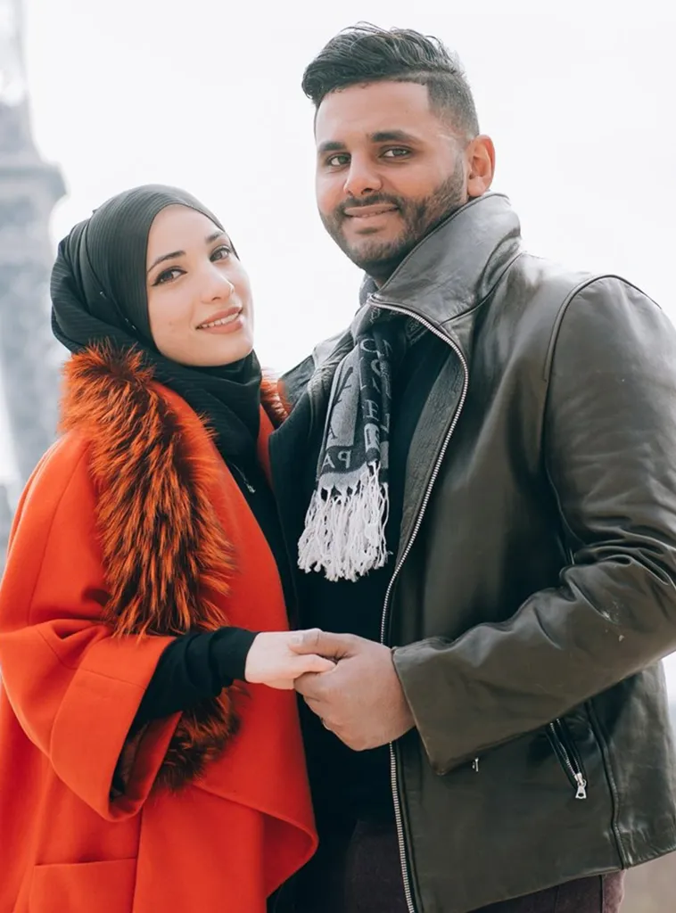 Ayat Masou and her husband Abdul Elenani holding hands.