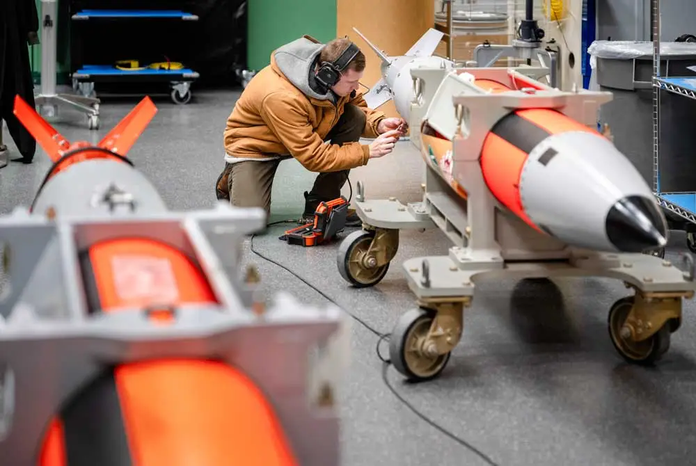 Personnel at Sandia National Laboratories working on a B61-13 high-fidelity unit.