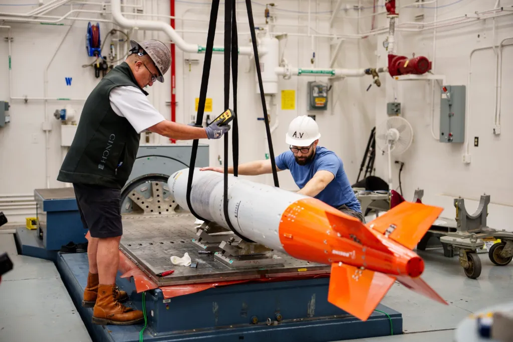 Sandia National Laboratories workers assemble a B61-13 high-fidelity unit.