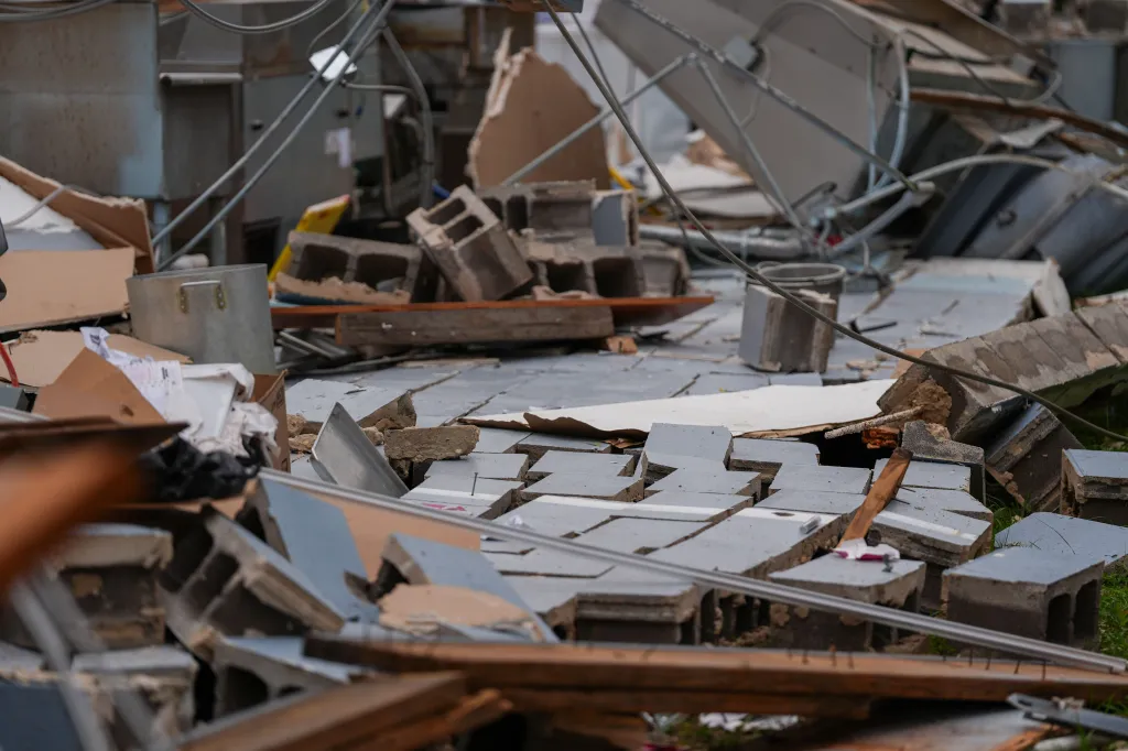 Debris and rubble scattered across the floor of the Milton Quick Stop after Hurricane Isaias.