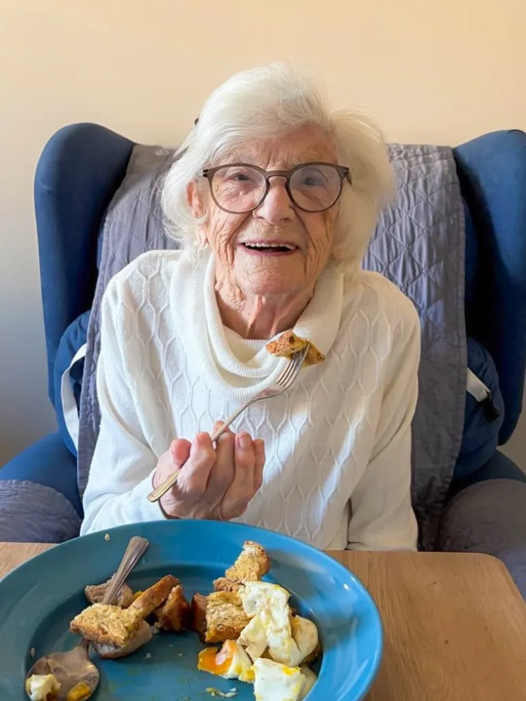 Dorothy Creighton eating breakfast.