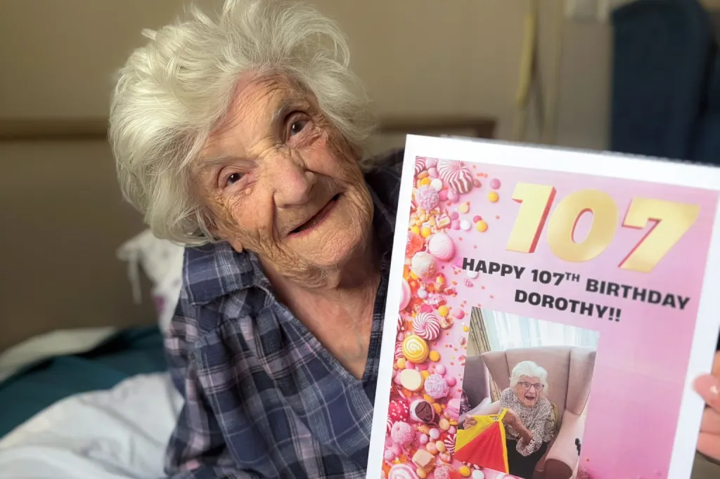 Dorothy Creighton holding her 107th birthday card.