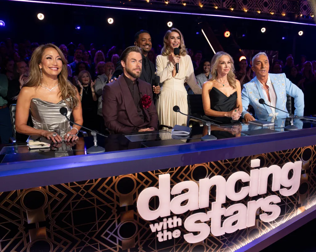 Judges and hosts Carrie Ann Inaba, Derek Hough, Alfonso Ribeiro, Julianne Hough, Kym Johnson-Herjavec, and Bruno Tonioli on the Dancing with the Stars panel.