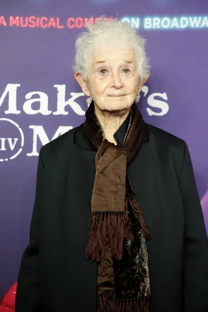 Barbara Barrie posing in front of a purple backdrop.