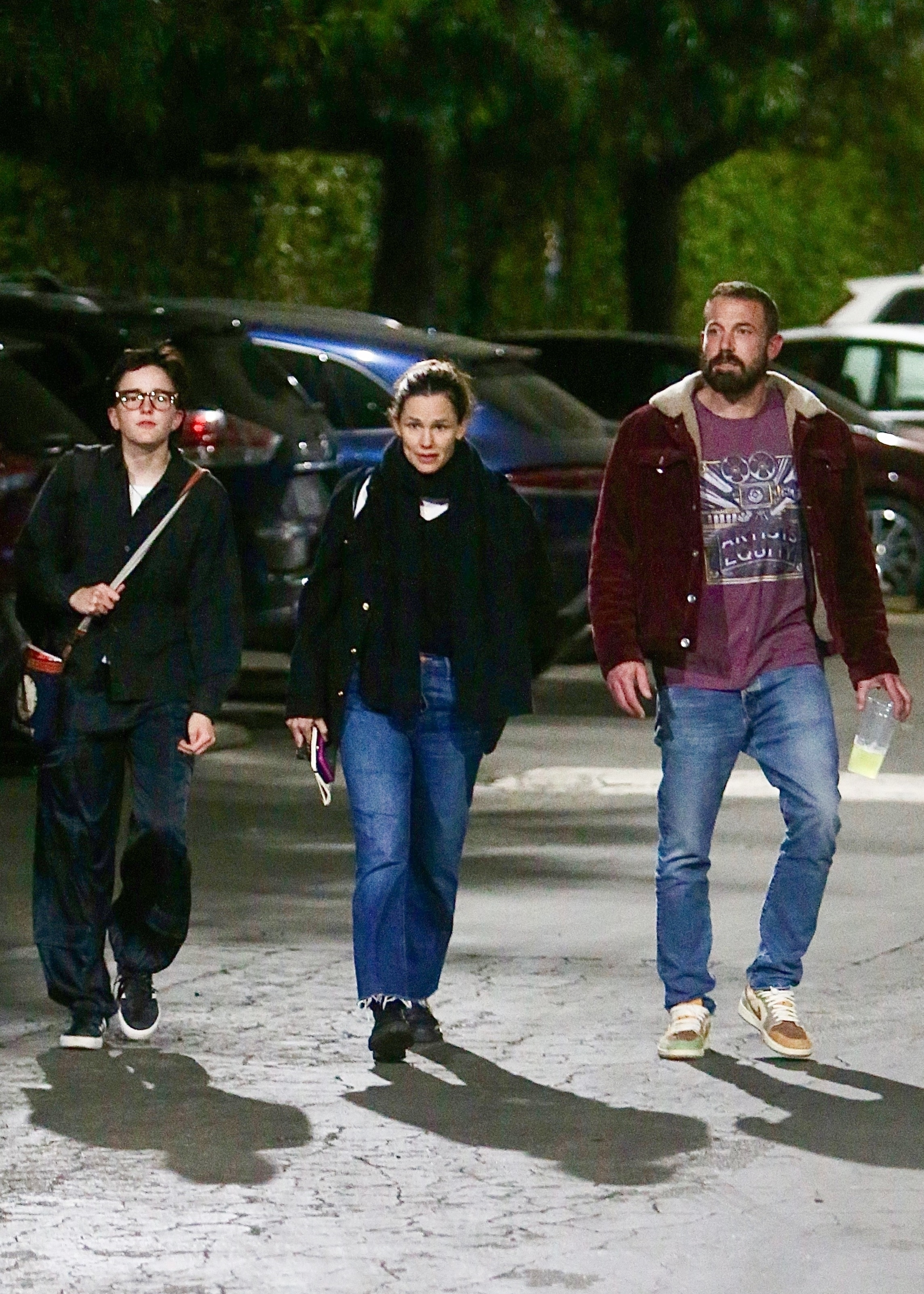Ben Affleck, Jennifer Garner, and their daughter Fin walking together at night in Los Angeles.