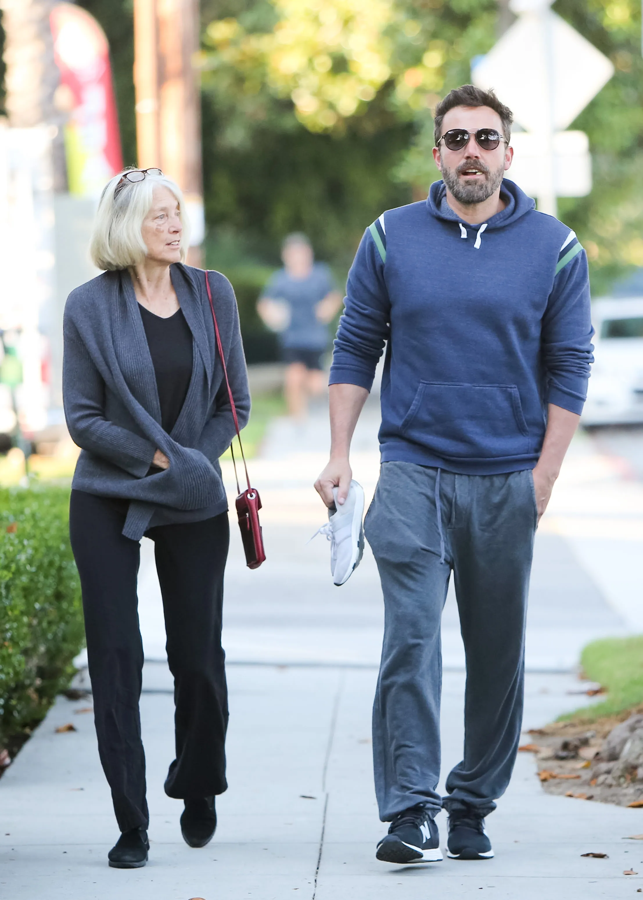 Ben Affleck and his mother, Christine Anne Boldt, walking together on a sidewalk.