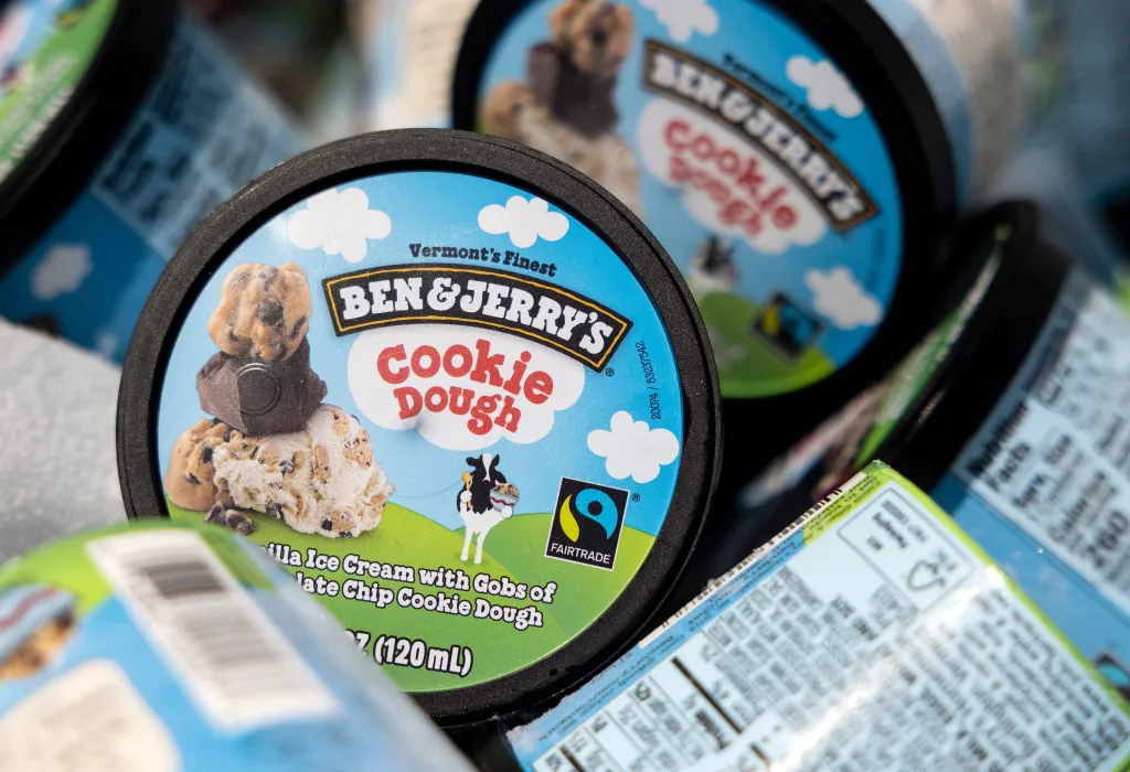 Ben & Jerry's Cookie Dough ice cream containers in a cooler.