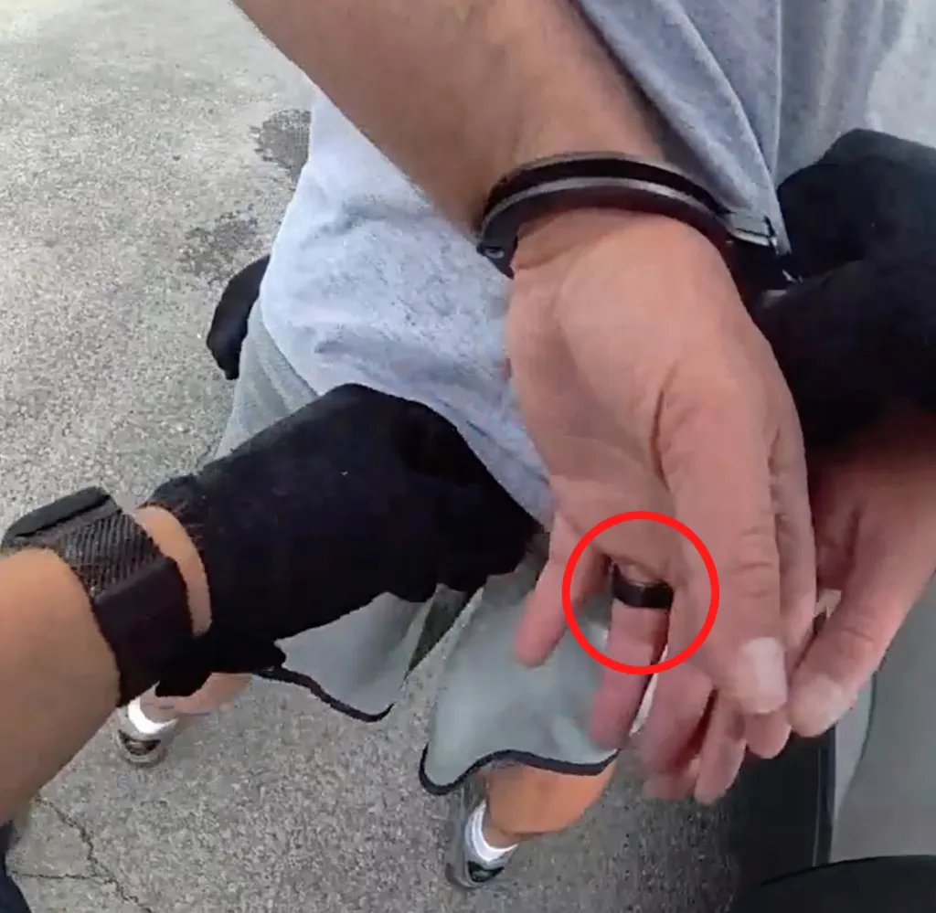 Body camera footage of Jed York being arrested in handcuffs.