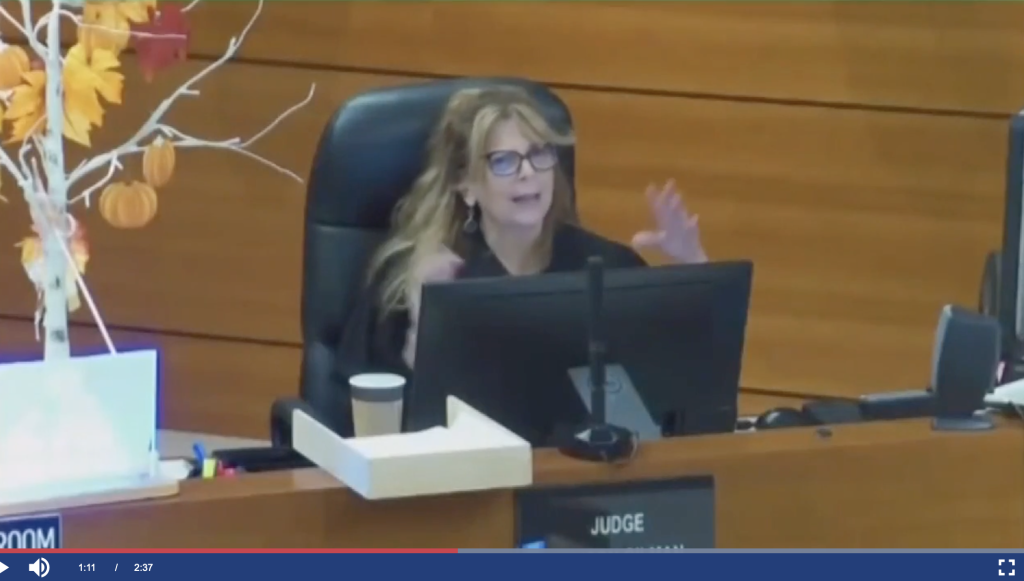 Broward judge in bond court talking and gesturing.
