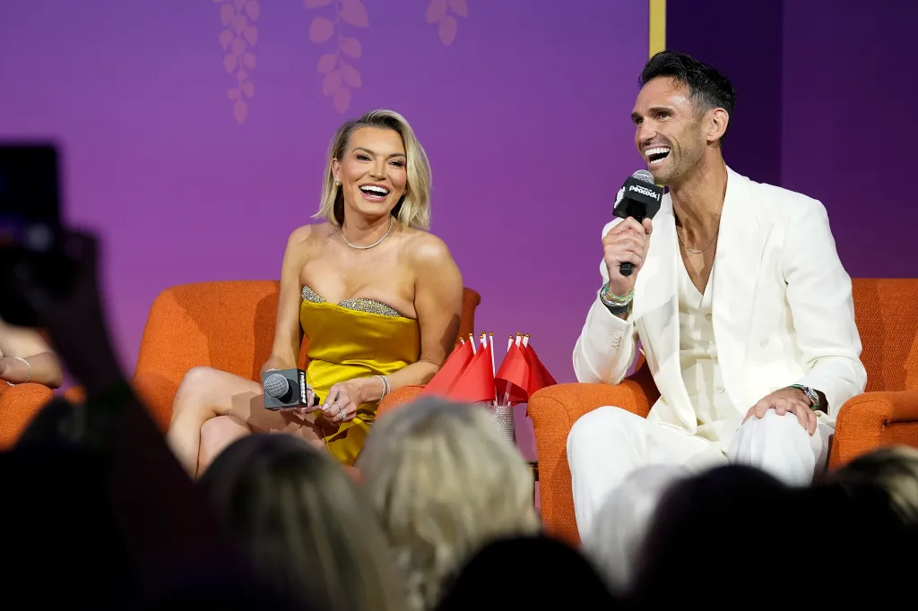 Lindsay Hubbard and Carl Radke laughing on stage during the Blind Loyalty panel at Bravo Fan Fest.