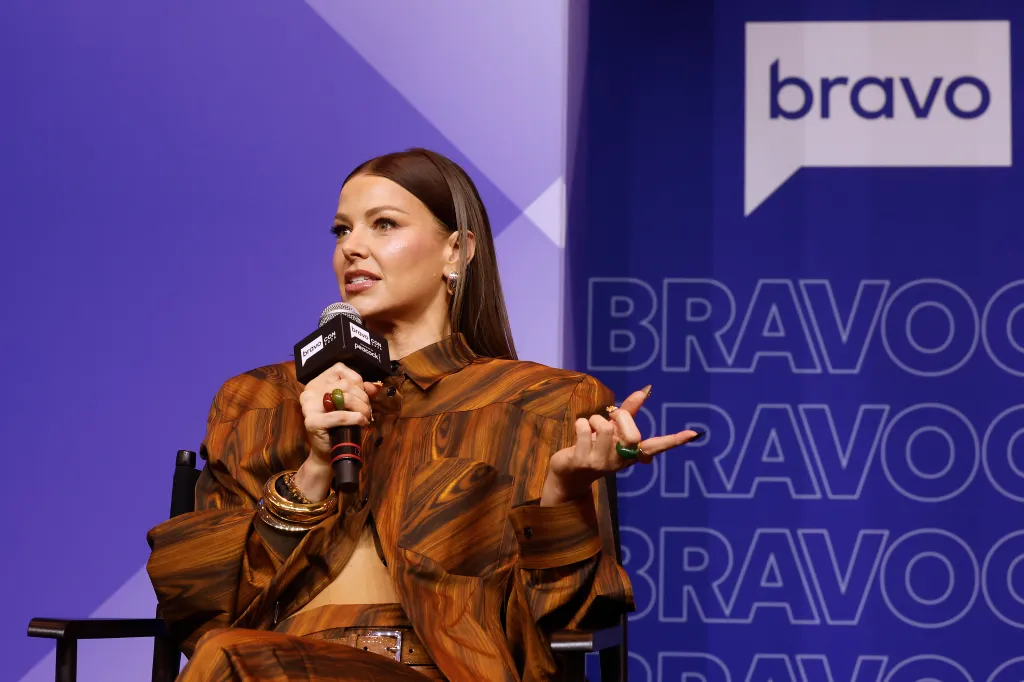Ariana Madix speaking on stage at BravoCon.