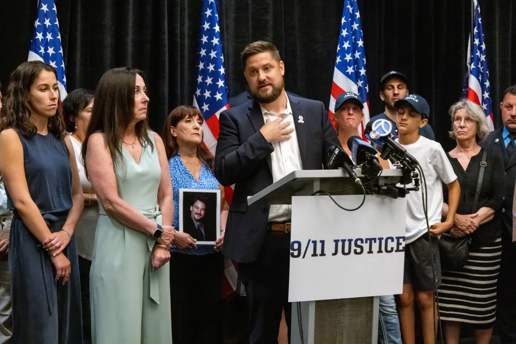 Brett Eagleson, president of 9/11 Justice, speaks at a press conference alongside family members of 9/11 victims.