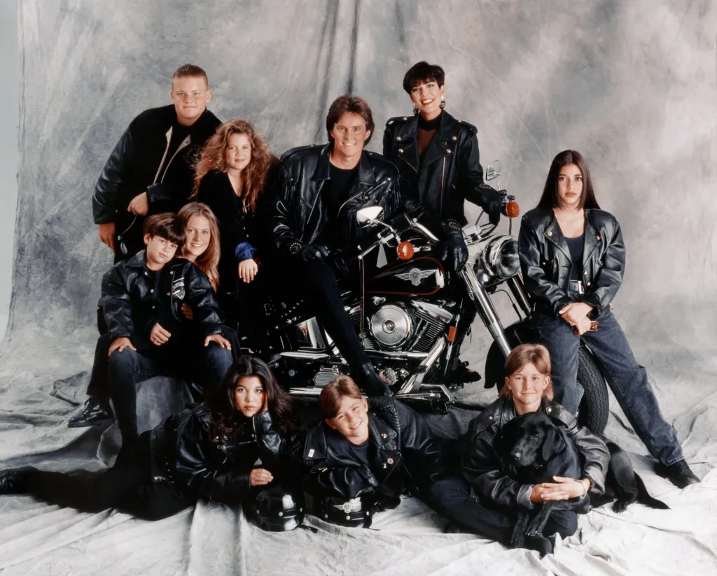 Photo of the Kardashian and Jenner families posing together, featuring Burton Jenner, Khloe Kardashian, Bruce Jenner, Kris Jenner, Kim Kardashian, Brandon Jenner, Brody Jenner, Kourtney Kardashian, Robert Kardashian, Jr. and Cassandra Jenner.