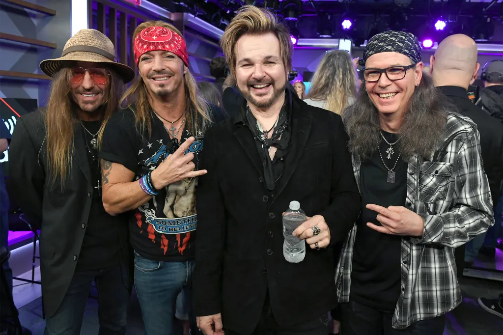 C.C. DeVille, Bret Michaels, Rikki Rockett, and Bobby Dall of Poison posing together.