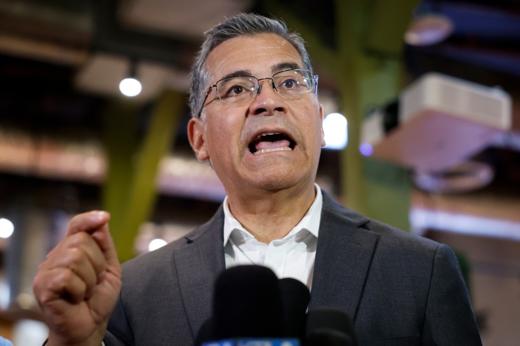 California Democratic gubernatorial candidate Xavier Becerra speaks with the media at a rally in Los Angeles.