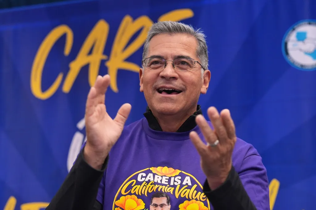 California Democratic gubernatorial candidate Xavier Becerra claps during a rally.