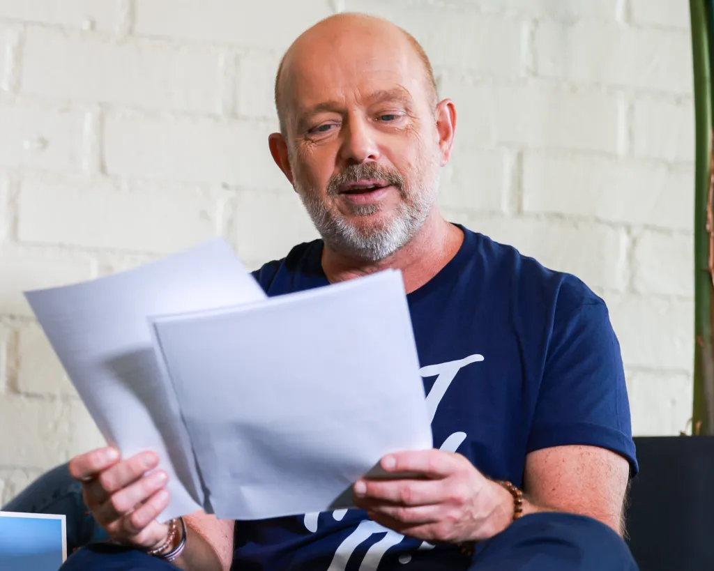 California Republican gubernatorial candidate Steve Hilton holds papers while speaking at an event.