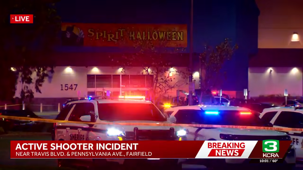 Police cars with flashing lights outside the Solano Town Center in Fairfield during an active shooter incident.