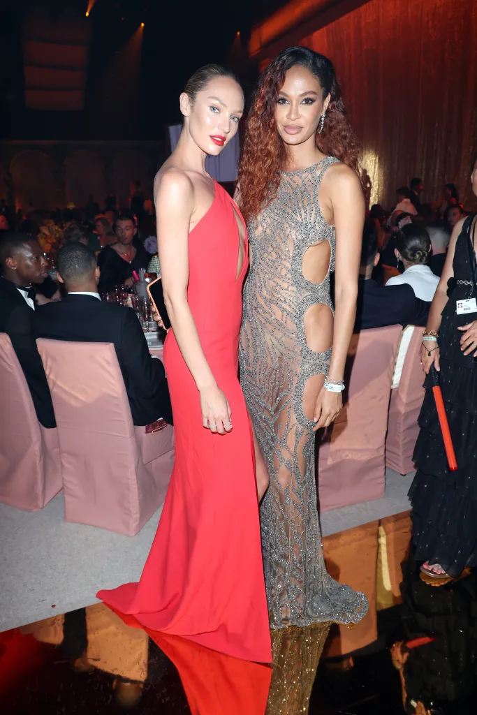 Candice Swanepoel and Joan Smalls pose during the amfAR Cannes Gala.