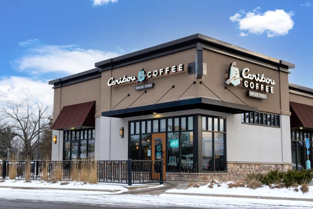 Exterior and trademark logo of a Caribou Coffee restaurant.