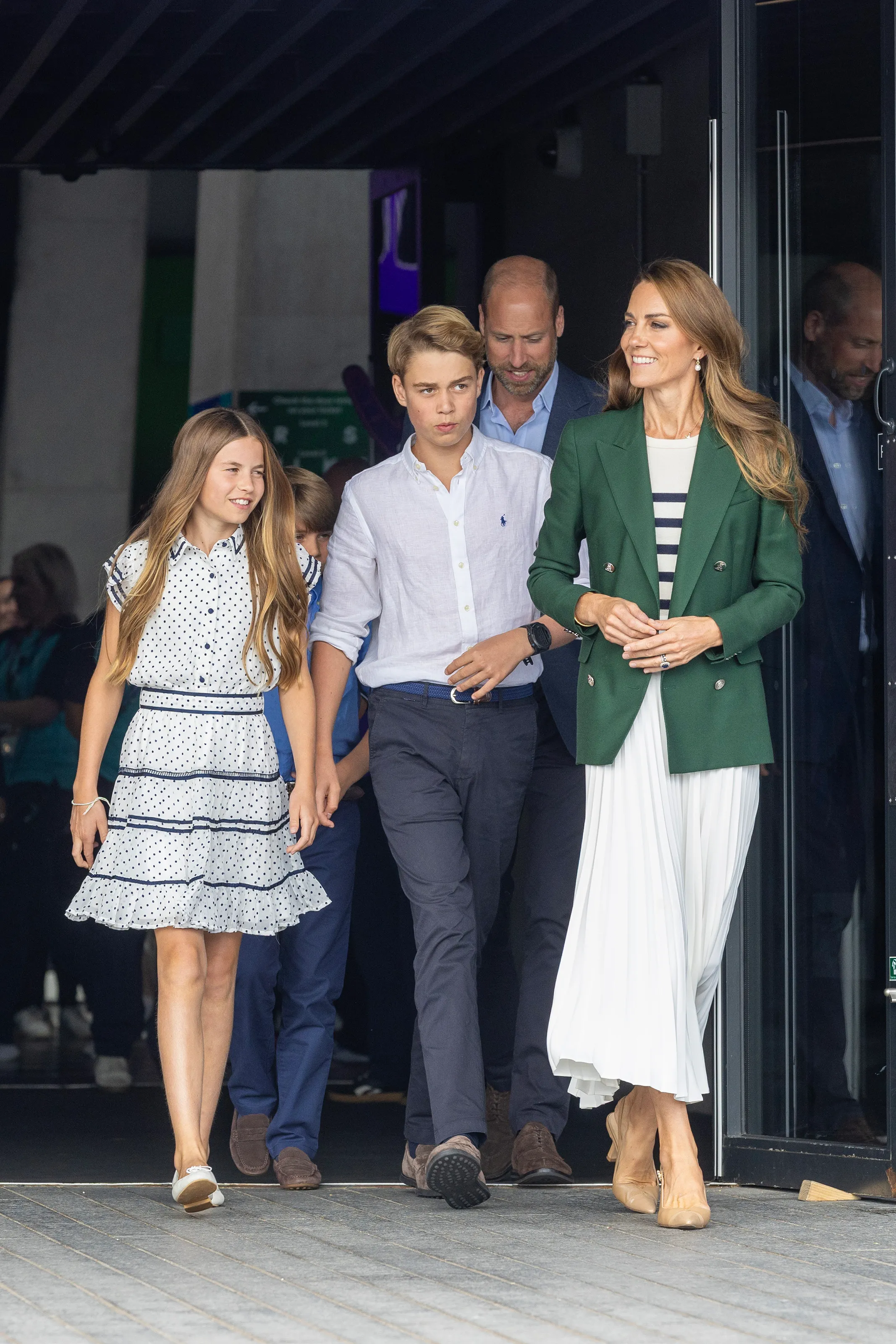 Catherine, Princess of Wales, Prince George, Princess Charlotte, Prince Louis and Prince William, Prince of Wales leave the Hydro Arena after attending the Commonwealth Games.