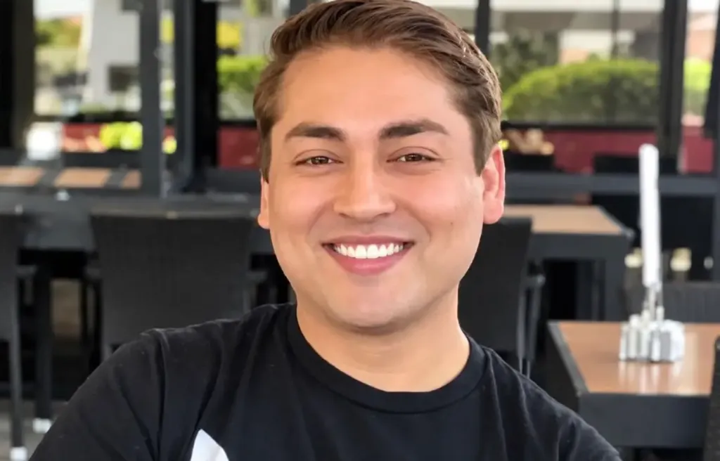 Cedric von Ferdinand smiling at a restaurant.