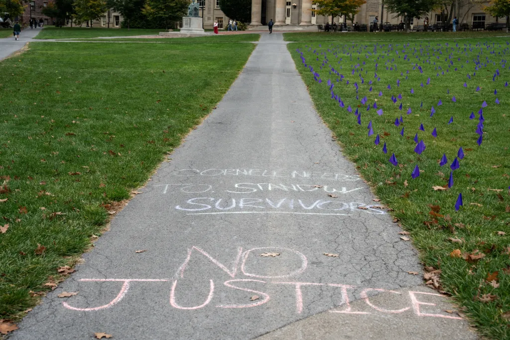 Chalk messages on a campus sidewalk reading 