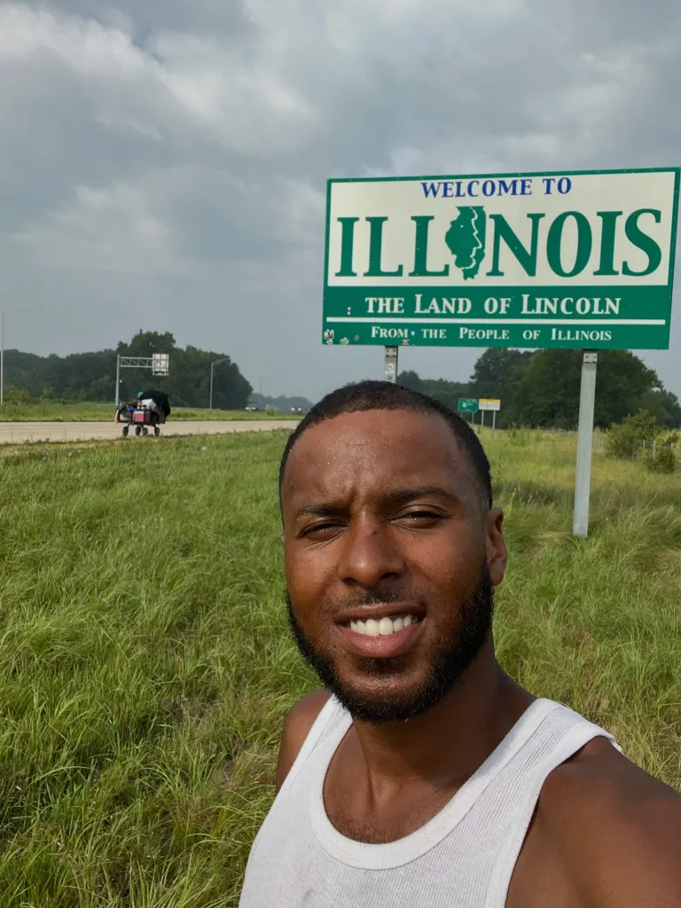 Chantz Rivera takes a selfie in front of a 