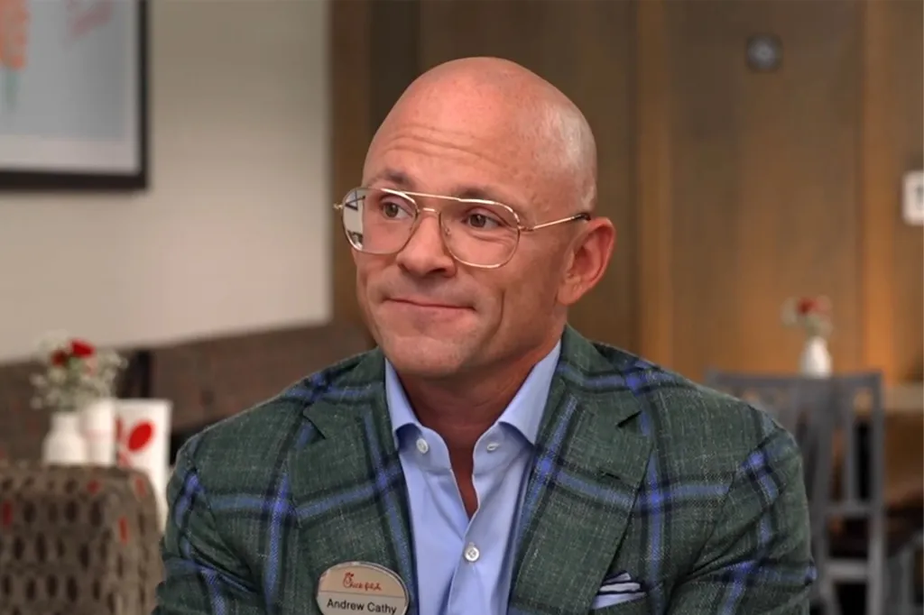 Chick-fil-A CEO Andrew Cathy in a plaid jacket and name tag.