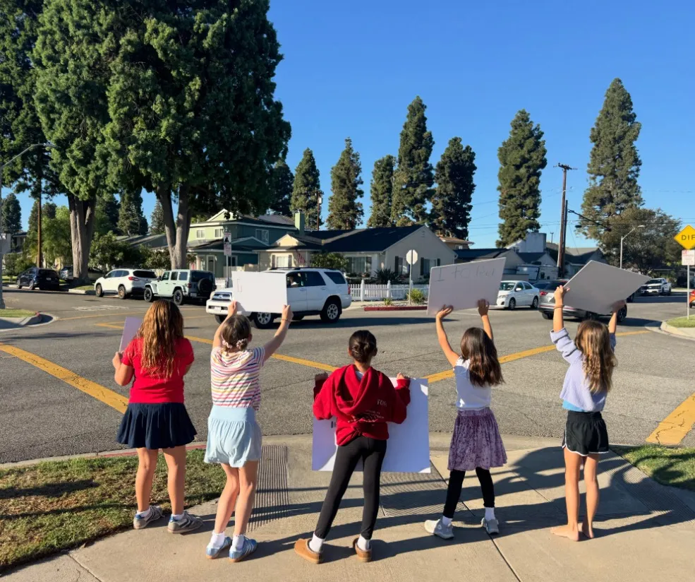 Children participate in a protest outside of Monroe Elementary School in Long Beach.