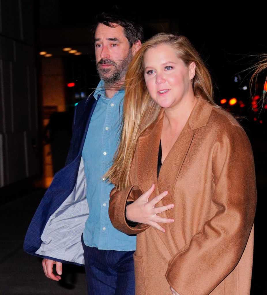 Amy Schumer and Chris Fischer seen together at night.
