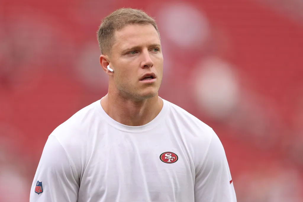 Christian McCaffrey of the San Francisco 49ers warms up on the field.