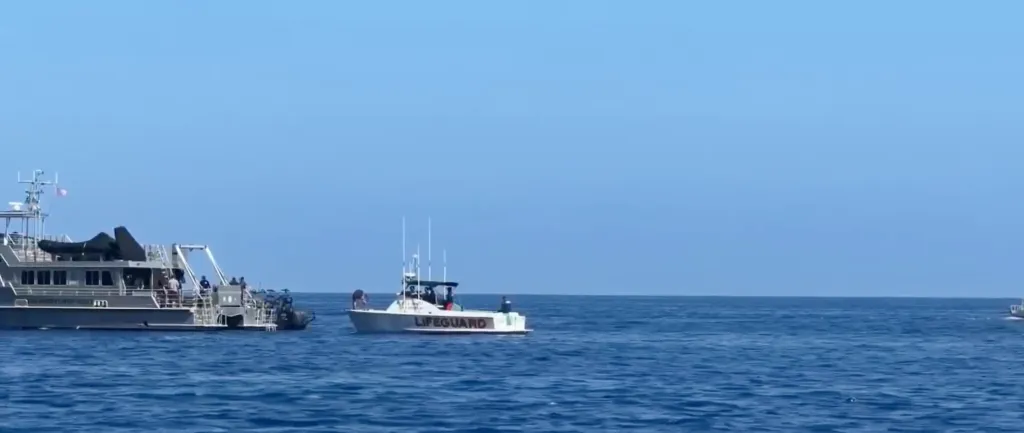 Lifeguard and rescue boats search the waters off Catalina Island following a medical helicopter crash.