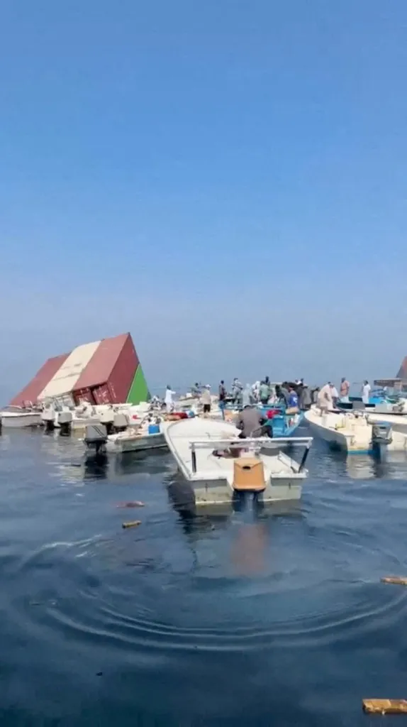 Containers float in the water after a vessel sank near the Strait of Hormuz.