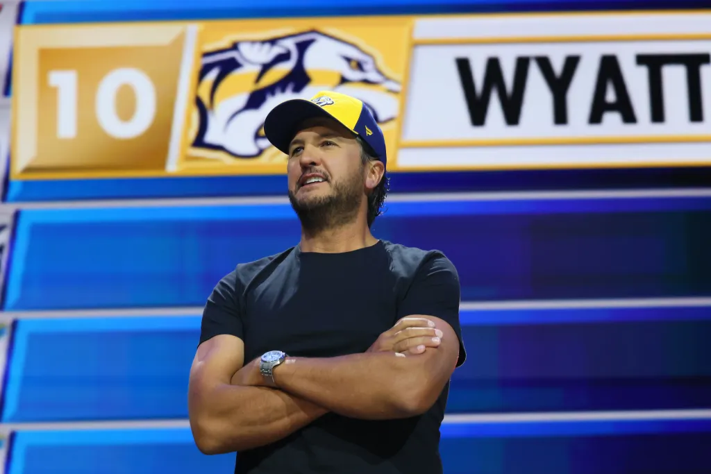 Country music artist Luke Bryan with arms crossed at the NHL Draft.