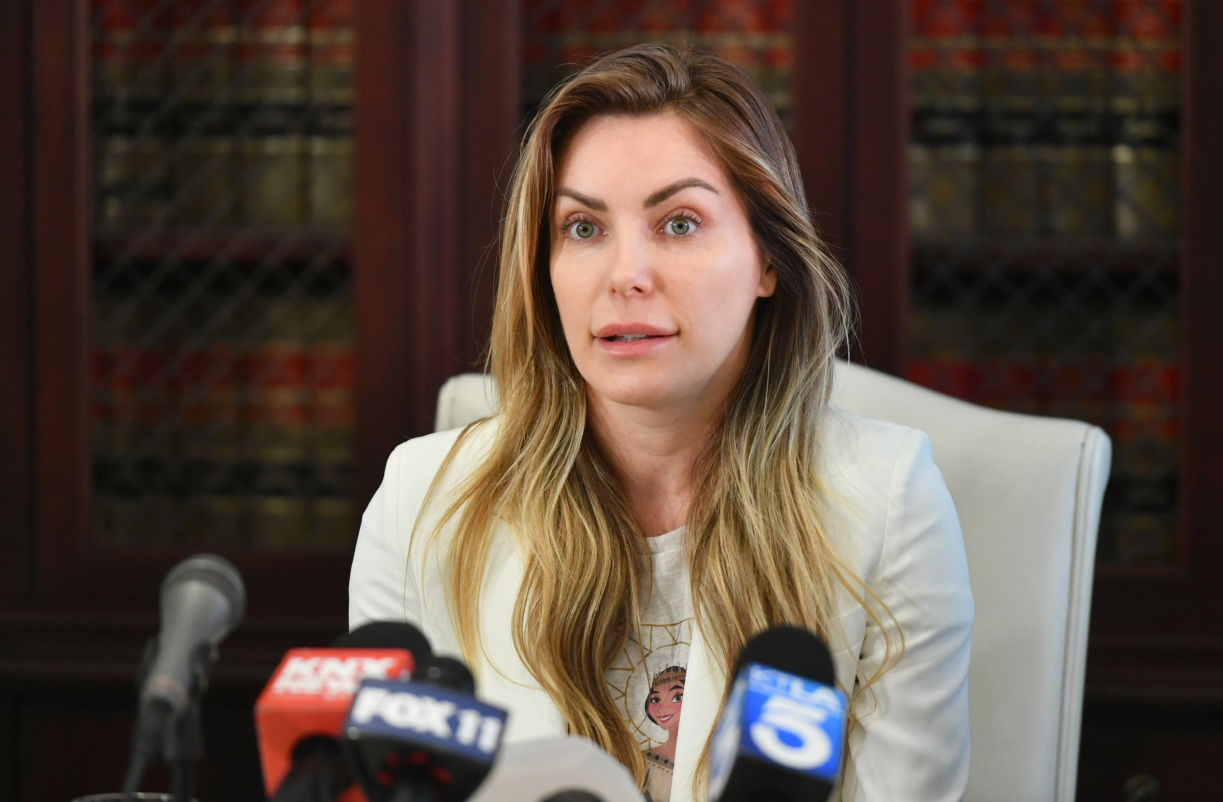 Crystal Hefner attending a press conference.