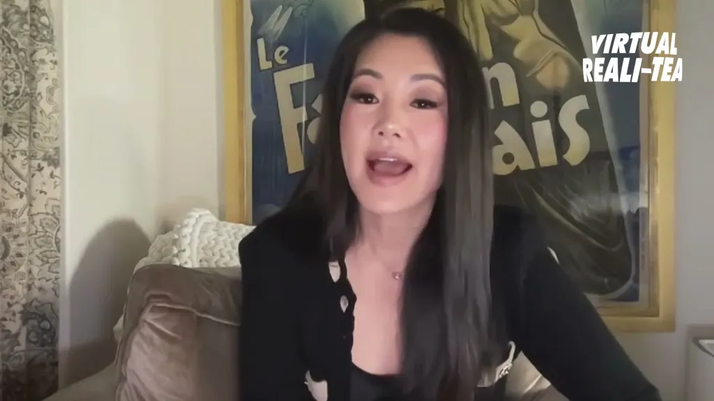 Crystal Kung Minkoff sitting on a couch.