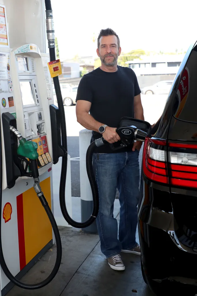 Csaba Mester pumps gas at a Shell station in Los Angeles.