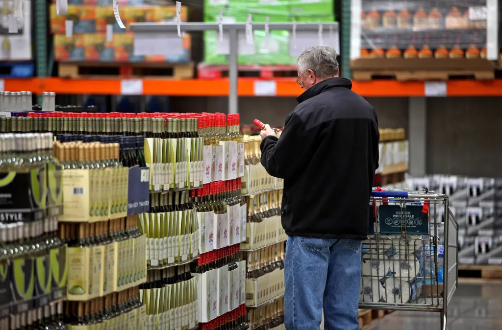 A customer shops for wine at a Costco Wholesale store.