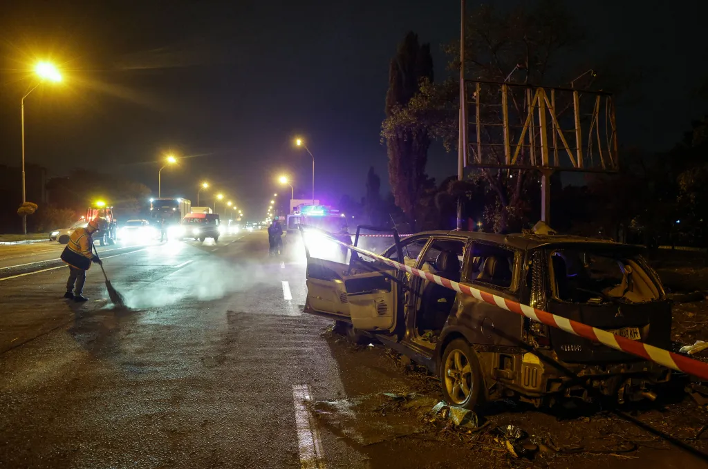 A damaged car sits at the site of a Russian missile strike on a road in a residential area in Kyiv, Ukraine, on Oct. 27, 2026. 
