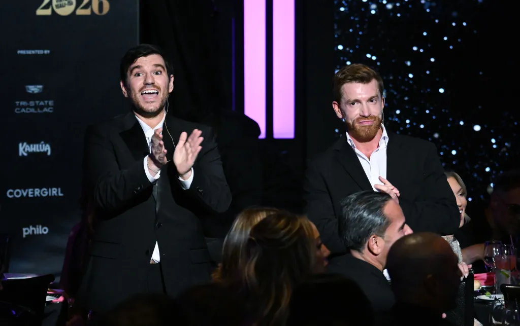 Danny Murphy and Evan Real stand and applaud at the Page Six Virtual Reali-Tea Awards.