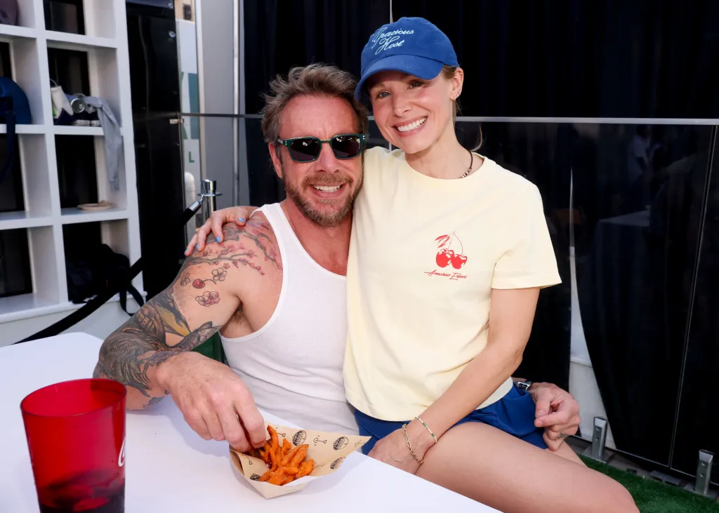 Dax Shepard and Kristen Bell sitting together at an event.