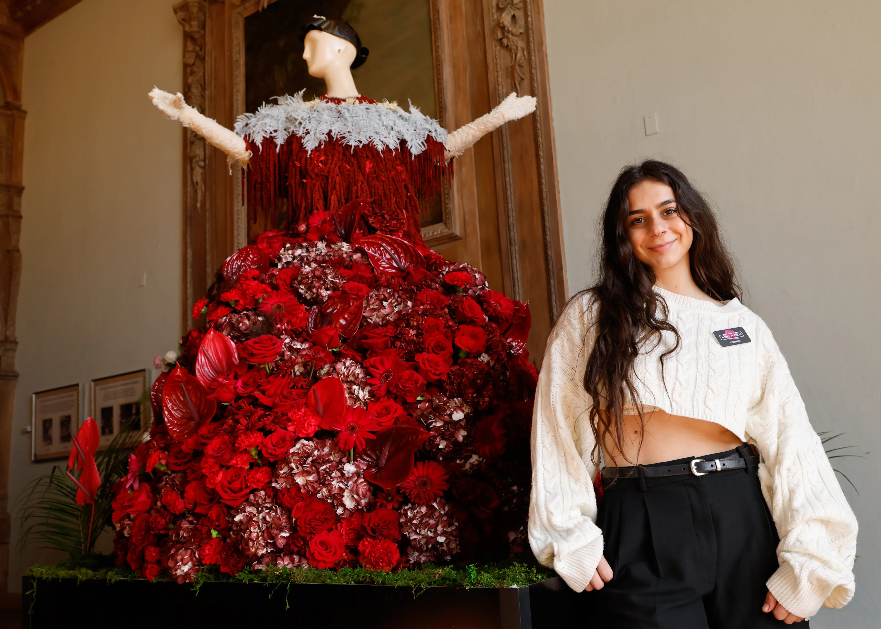 Lousin Derkhorenian stands next to her floral sculpture of Mrs. Fish at Fleurs de Villes.