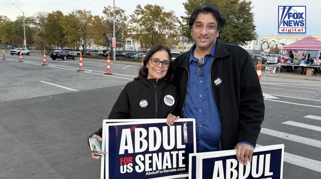 Two El-Sayed supporters hold 