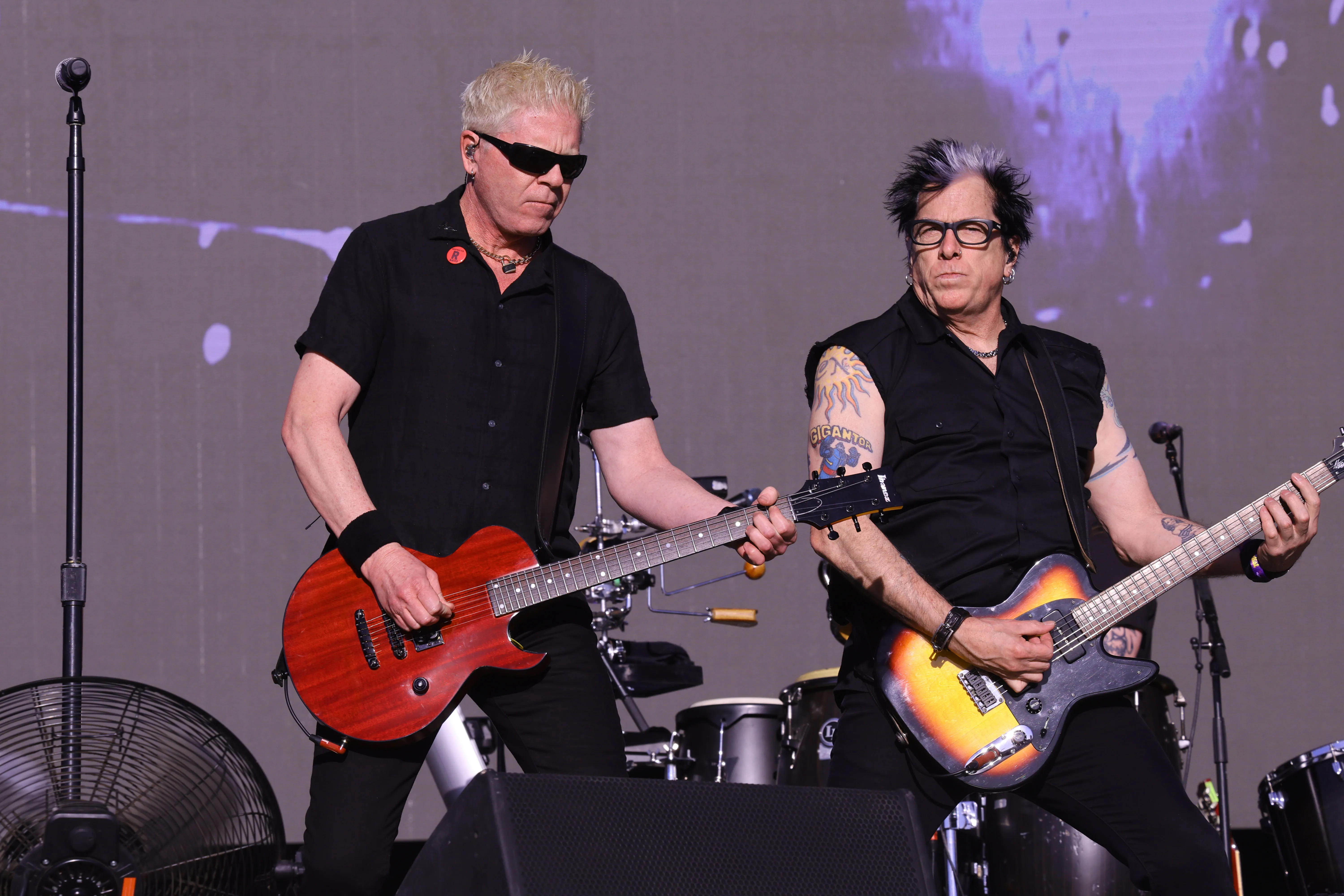 Dexter Holland and Noodles of The Offspring perform on stage.