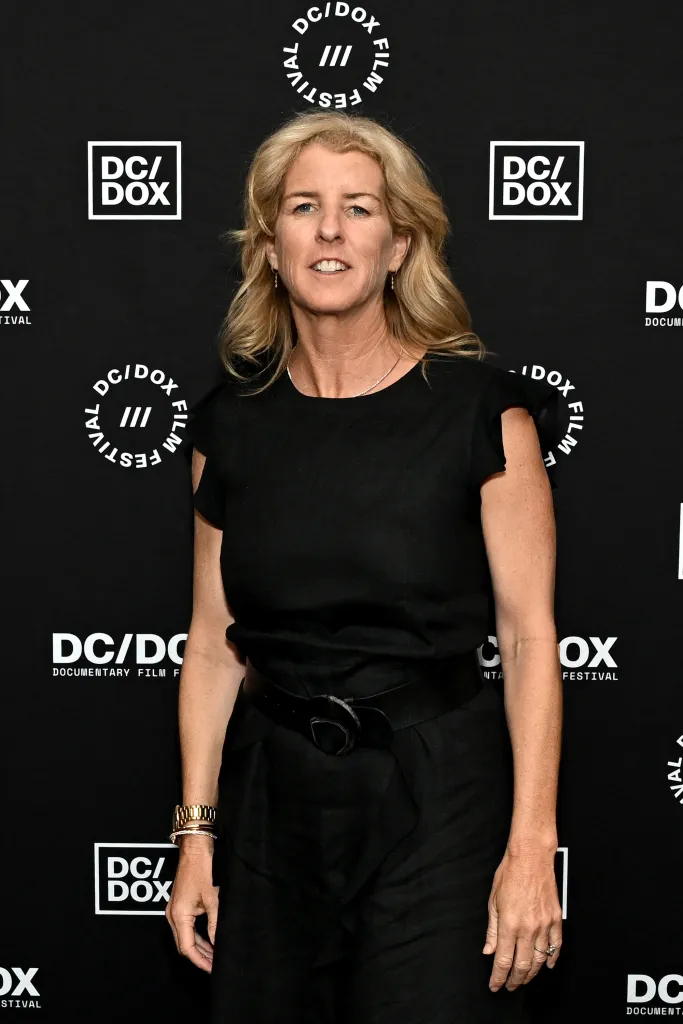 Director Rory Kennedy standing in front of a DC/DOX Film Festival backdrop.