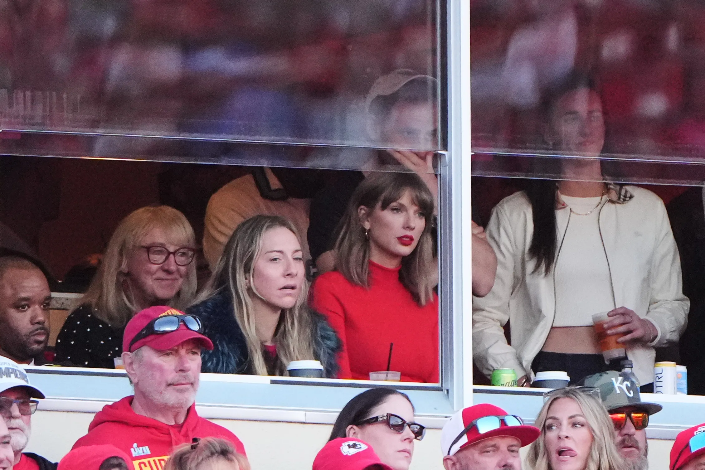 Donna Kelce, Este Haim, Taylor Swift, and Caitlin Clark watch an NFL game from a suite.