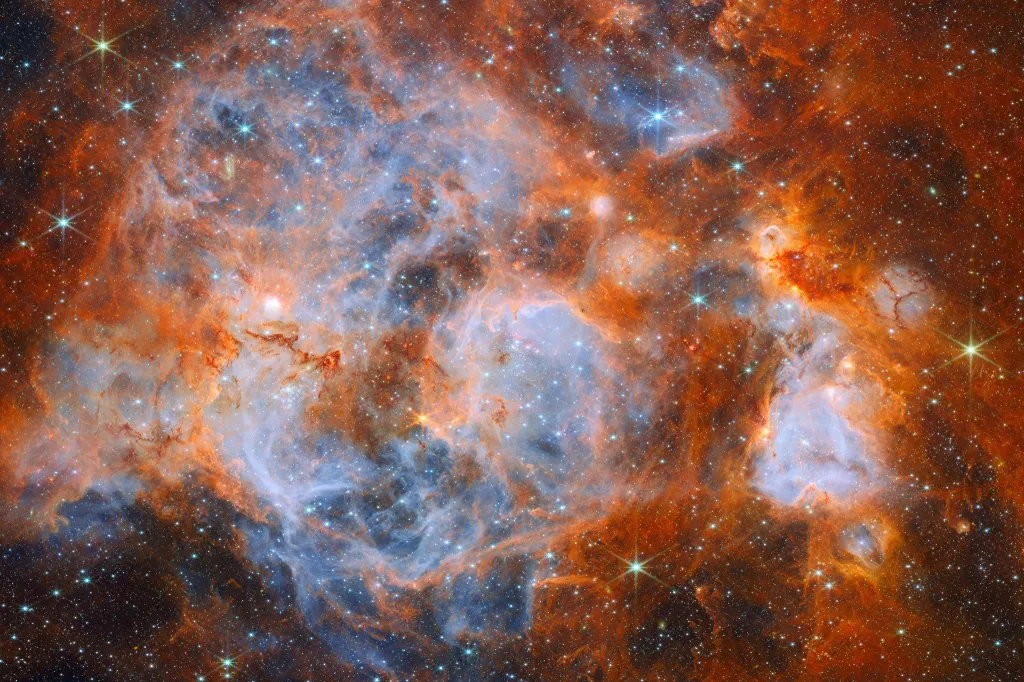 James Webb Space Telescope image of N159, a turbulent star-forming region in the Large Magellanic Cloud.