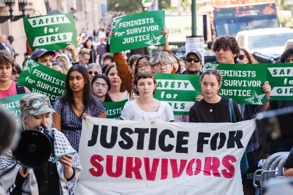 Columbia and Barnard students gather at a rally holding signs that read 